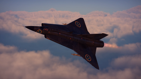 A saab draken flying through thick overcast with a sunset illuminating the clouds below it.